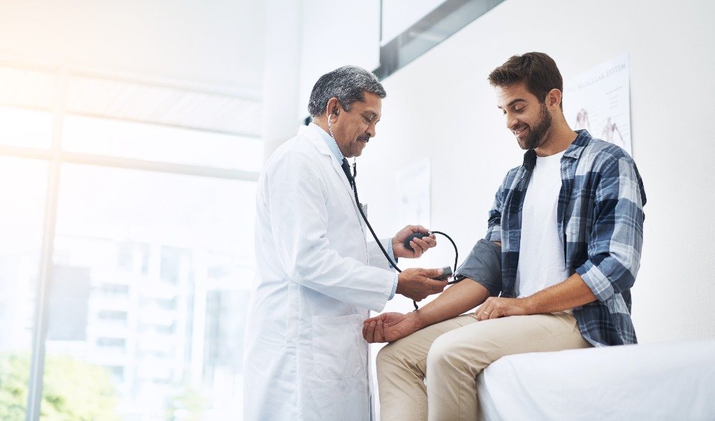 Doctor checking blood pressure of a patient during a routine health checkup